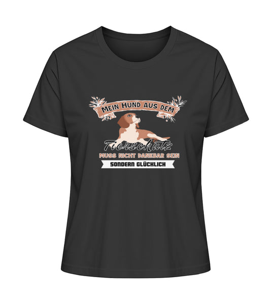 Tierschutz mit Bedeutung – Trage die kraftvolle Botschaft - Mein Hund aus dem Tierschutz muss nicht dankbar, sondern glücklich sein auf diesem schwarzen Bio-Baumwoll Shirt. Ein Statement für Tierfreunde